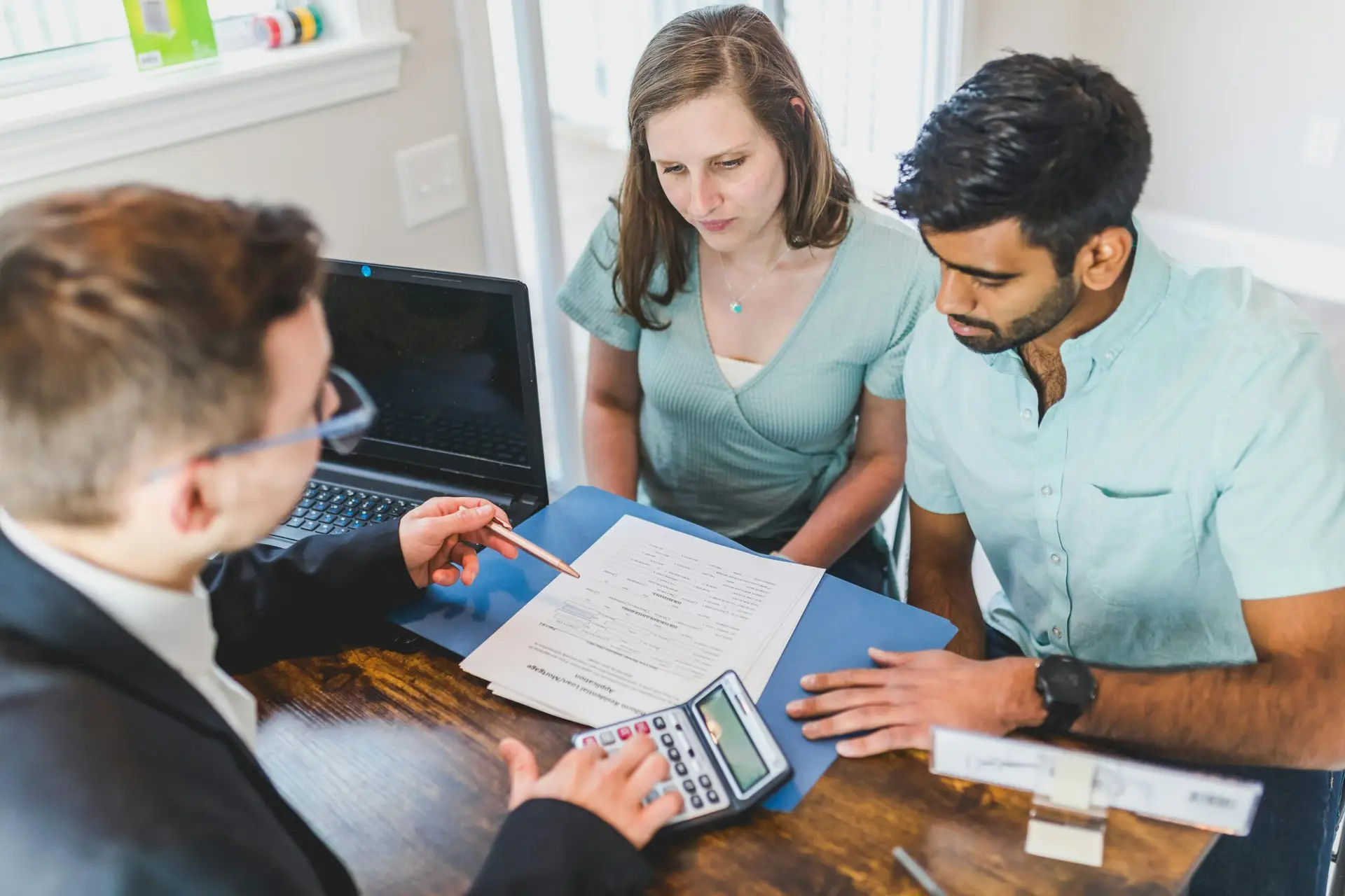 buying your first home - couple looking at a clip board