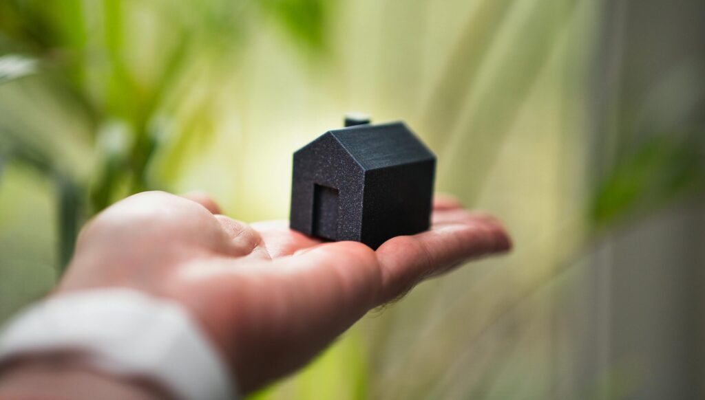 Rent guarantee, house in palm of hand