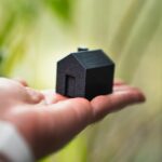 Rent guarantee, house in palm of hand